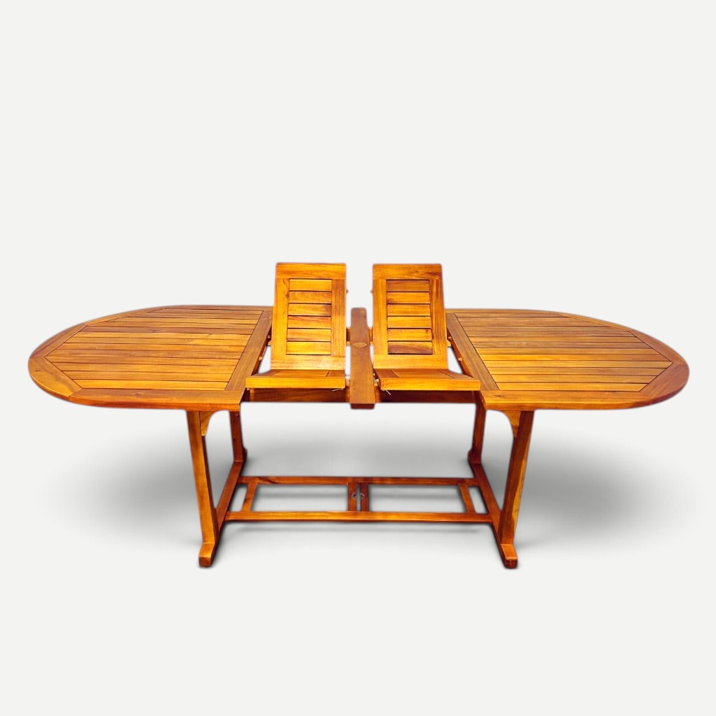 Hawaiian Discovery Furniture acacia wood oval extension table with a natural finish for indoor or outdoor dining.