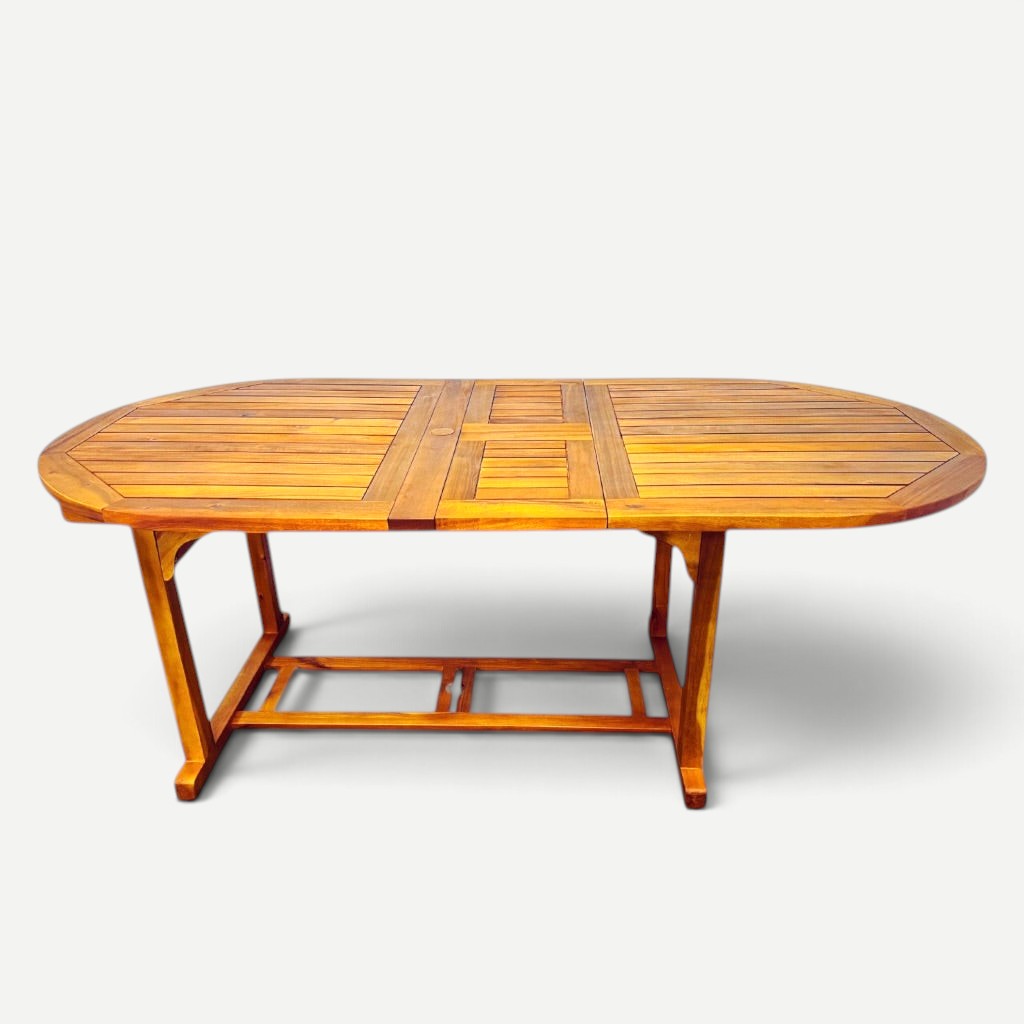 Hawaiian Discovery Furniture oval extension table made of natural plantation-grown acacia wood for indoor or outdoor use