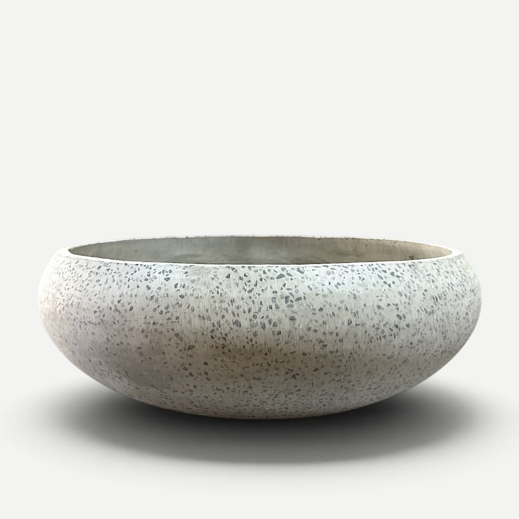 Hawaiian Discovery Furniture Calabash terrazzo bowl planter in grey with a speckled stone and cement finish.