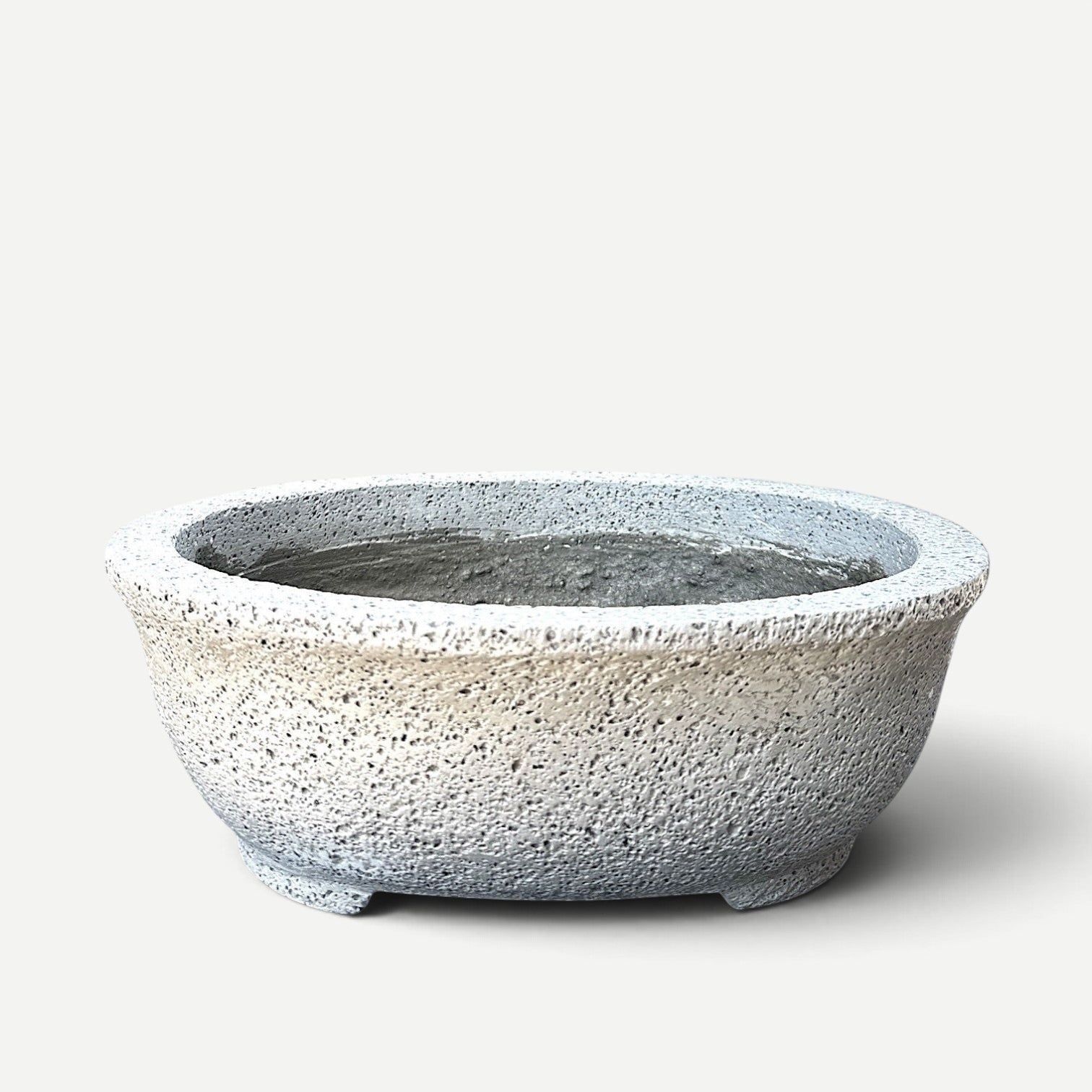 Hawaiian Discovery Furniture Kumo oval bonsai planter made from lightweight concrete and recycled foam with texture.