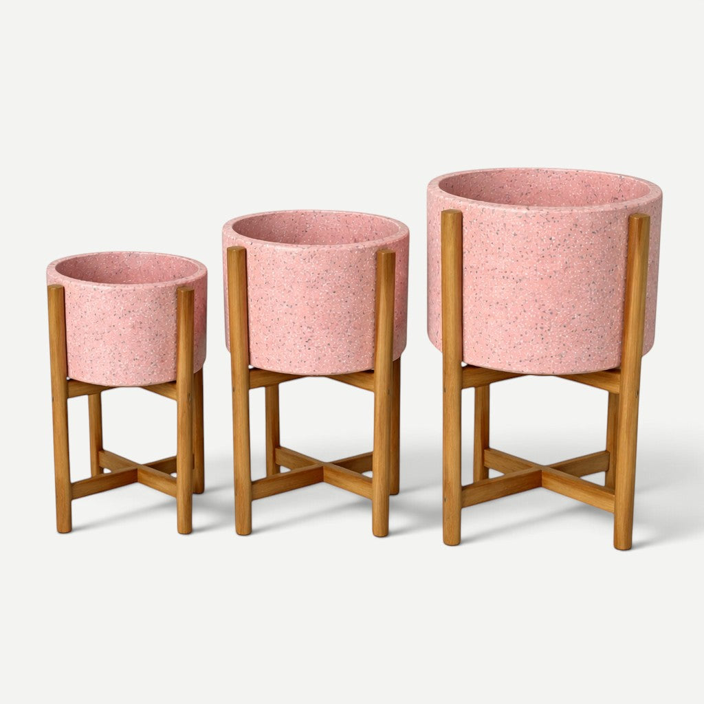 Hawaiian Discovery Furniture pink terrazzo planters with acacia wood stands in three graduated sizes