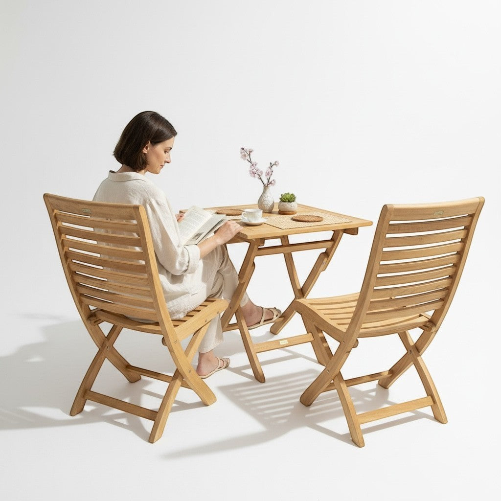 Hawaiian Discovery Furniture Kakahiaka teak wood bistro set with two folding chairs and a square folding table.