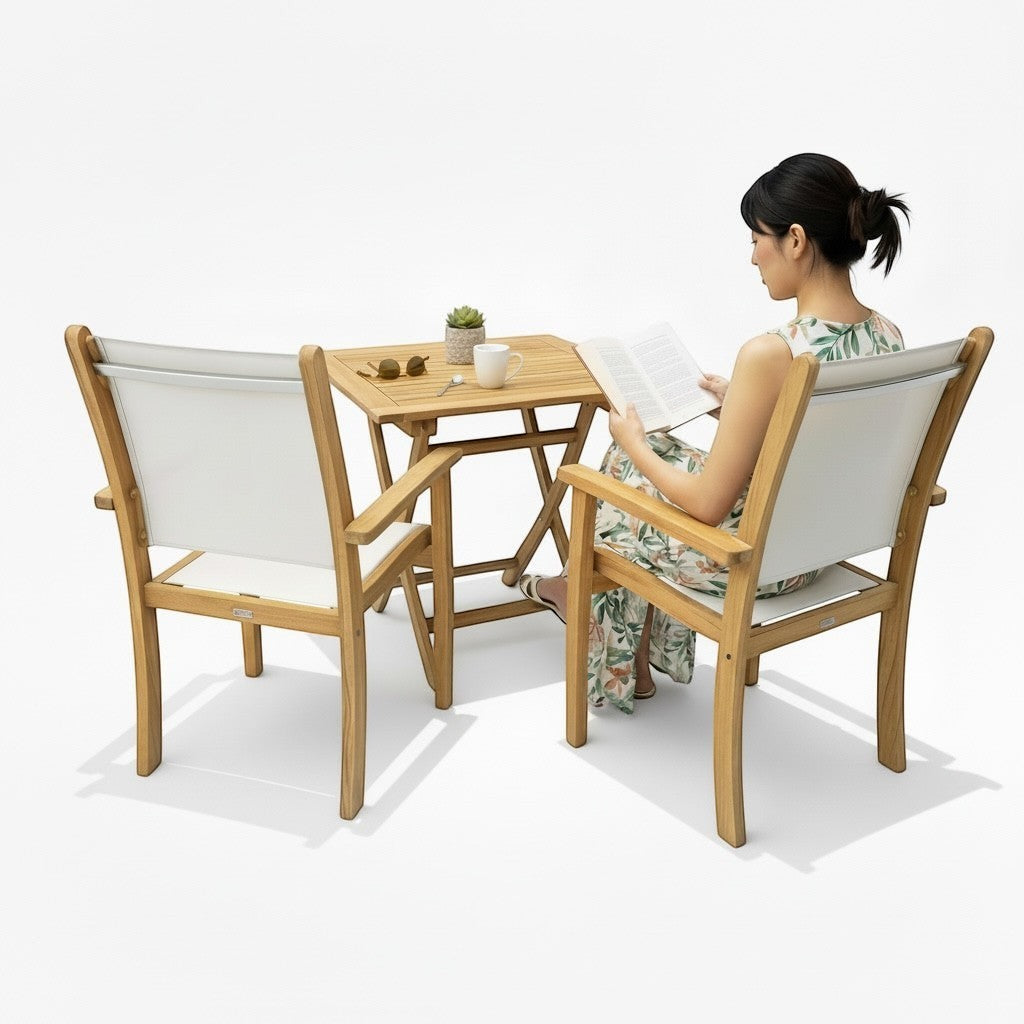 Hawaiian Discovery Furniture Kakahiaka teak bistro set with a square folding table and two white sling armchairs.