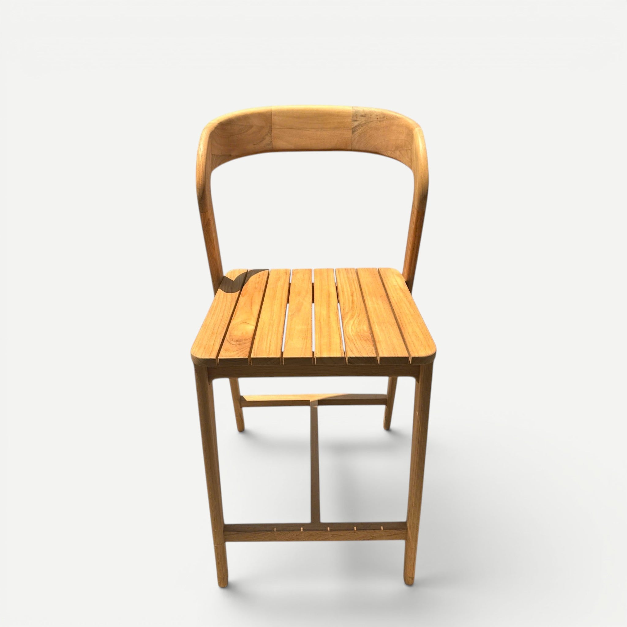 Hawaiian Discovery Furniture Noho teak counter stool with a slatted seat, curved backrest, and natural wood finish.