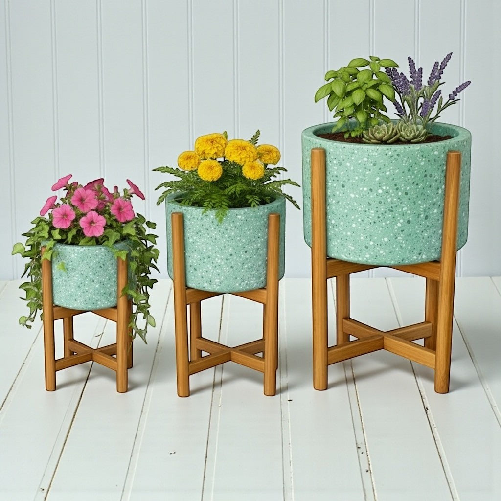 Hawaiian Discovery Furniture terrazzo planters in mint green with acacia wood stands in three different sizes