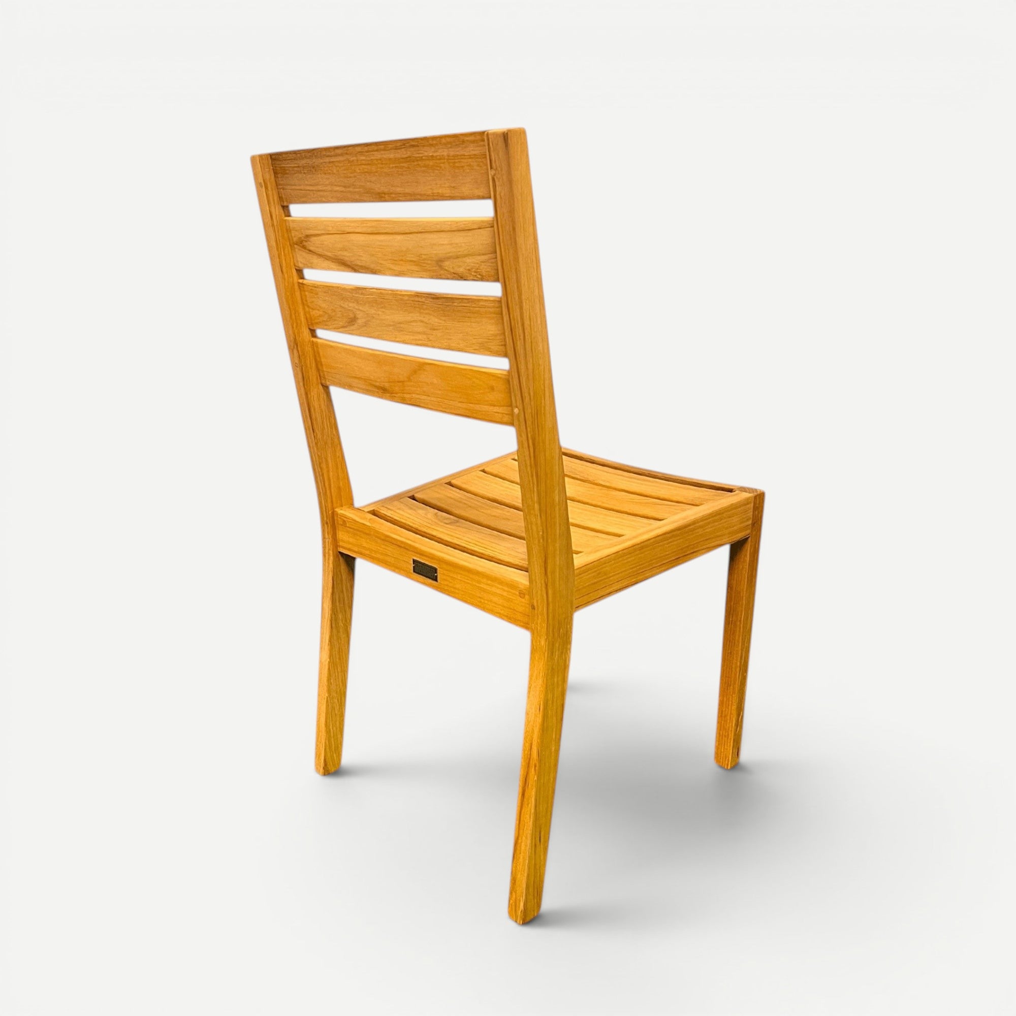 Hawaiian Discovery Furniture Venice teak outdoor side chair with a slatted back and natural golden wood finish.