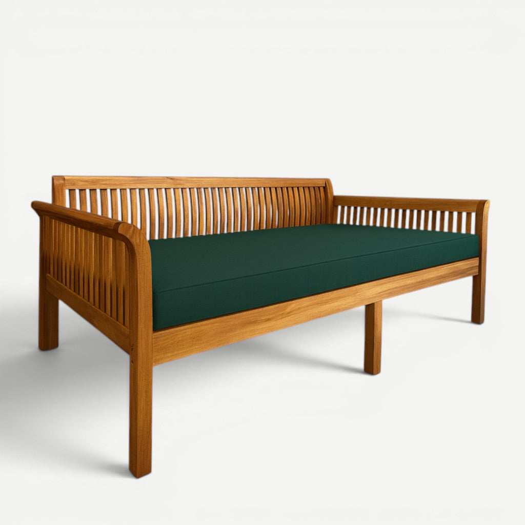 Hawaiian Discovery Furniture Riviera daybed made of acacia wood with a dark green twin-size cushion.