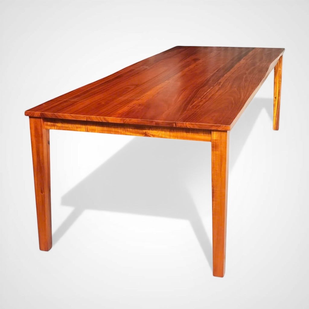 Hawaiian Discovery Furniture Molokai 10-seater dining table crafted from rich brown plantation-grown Acacia hardwood.