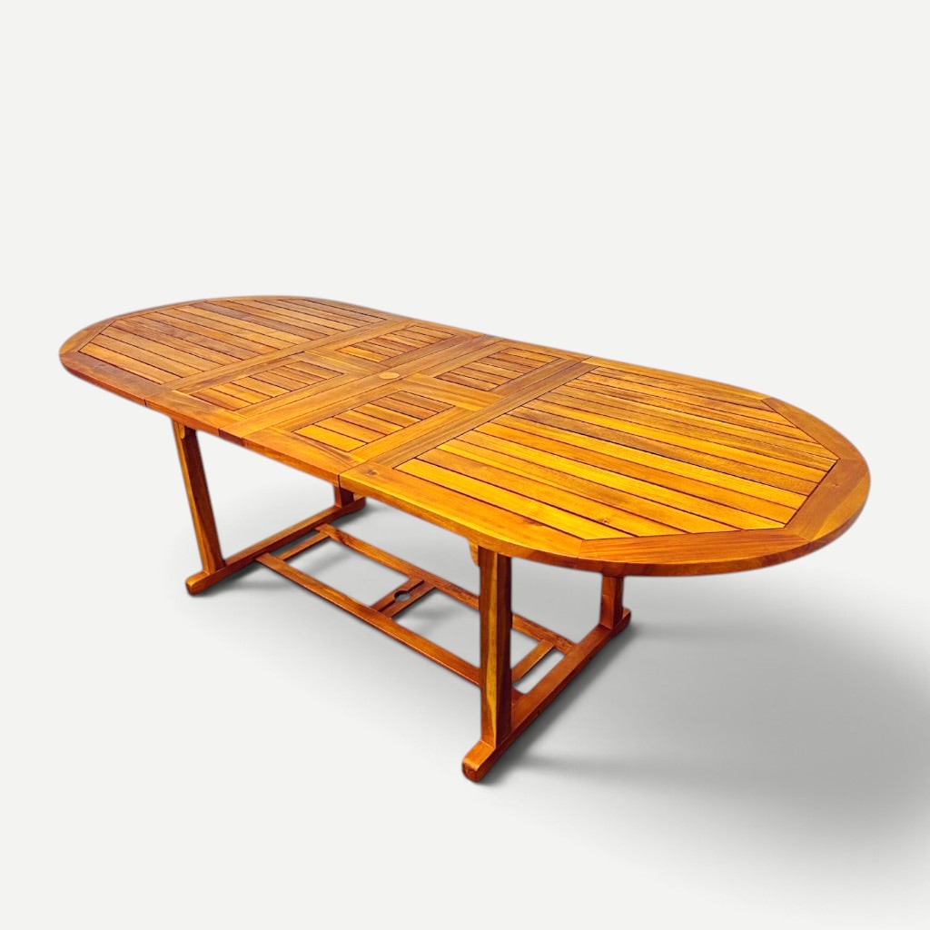 Hawaiian Discovery Furniture oval extension table made of natural plantation-grown acacia wood for indoor or outdoor use
