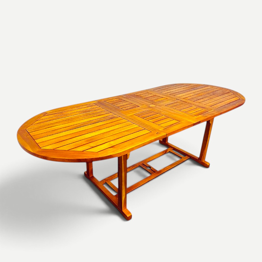 Hawaiian Discovery Furniture oval extension dining table made from natural plantation-grown acacia wood.