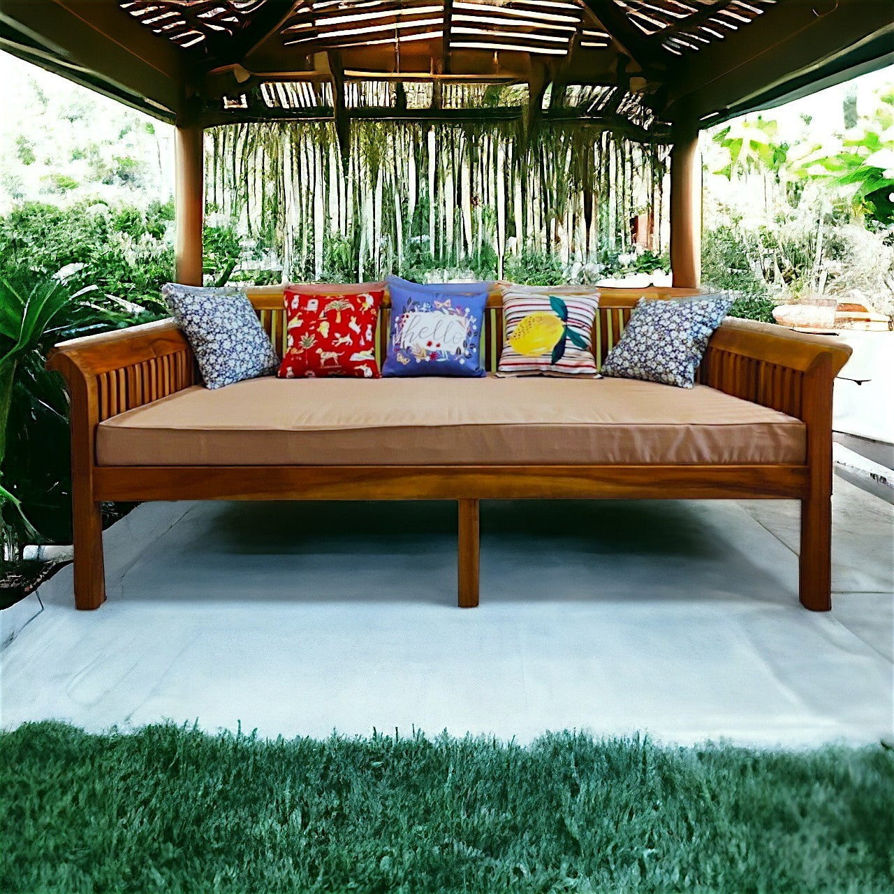 Hawaiian Discovery Furniture Riviera daybed in acacia wood with a taupe twin cushion and decorative throw pillows.