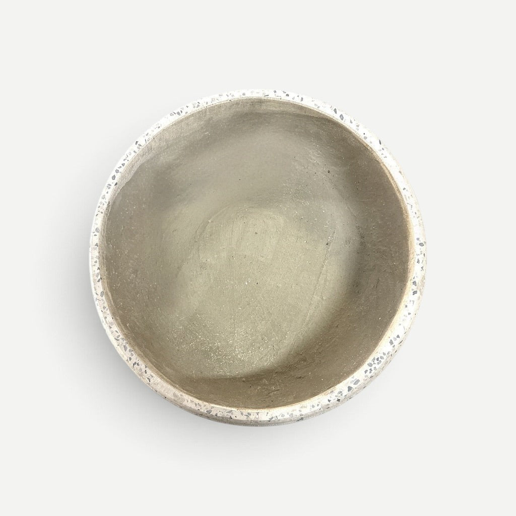 Hawaiian Discovery Furniture Calabash terrazzo planter bowl with a grey cement interior and speckled stone rim.