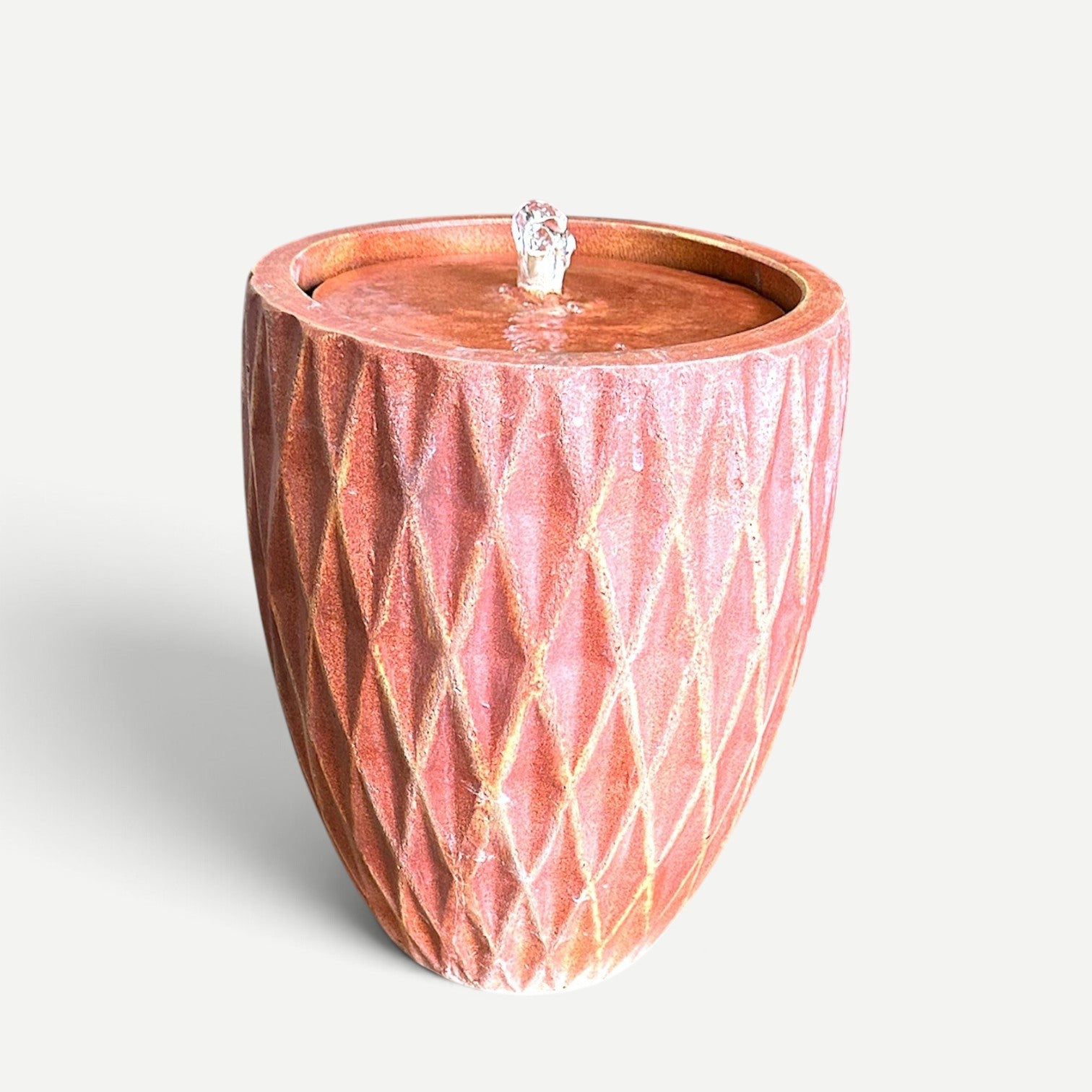 Hawaiian Discovery Furniture dark orange cement fountain with a textured diamond pattern for indoor or outdoor use.