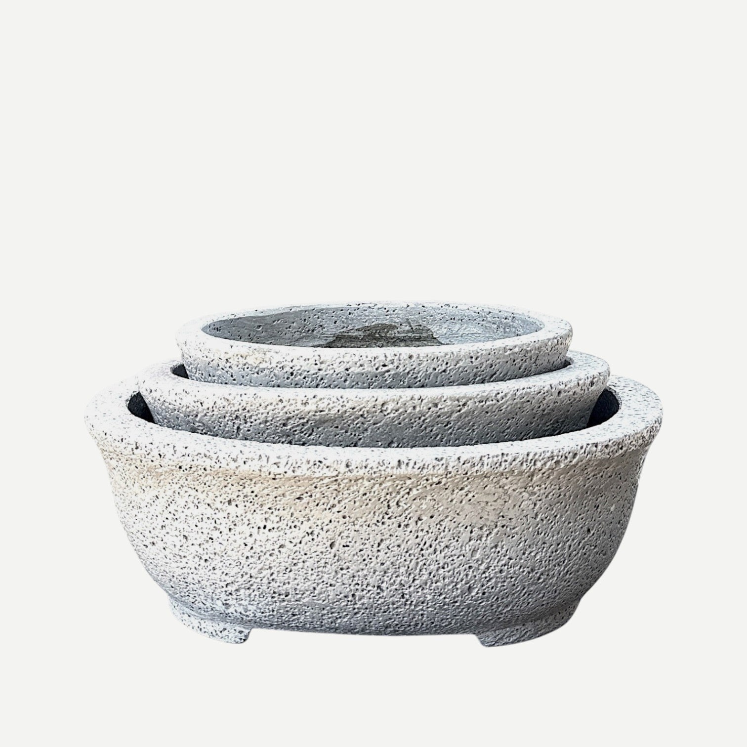 Hawaiian Discovery Furniture Kumo oval bonsai planters in a nested set, made of lightweight grey concrete and foam.