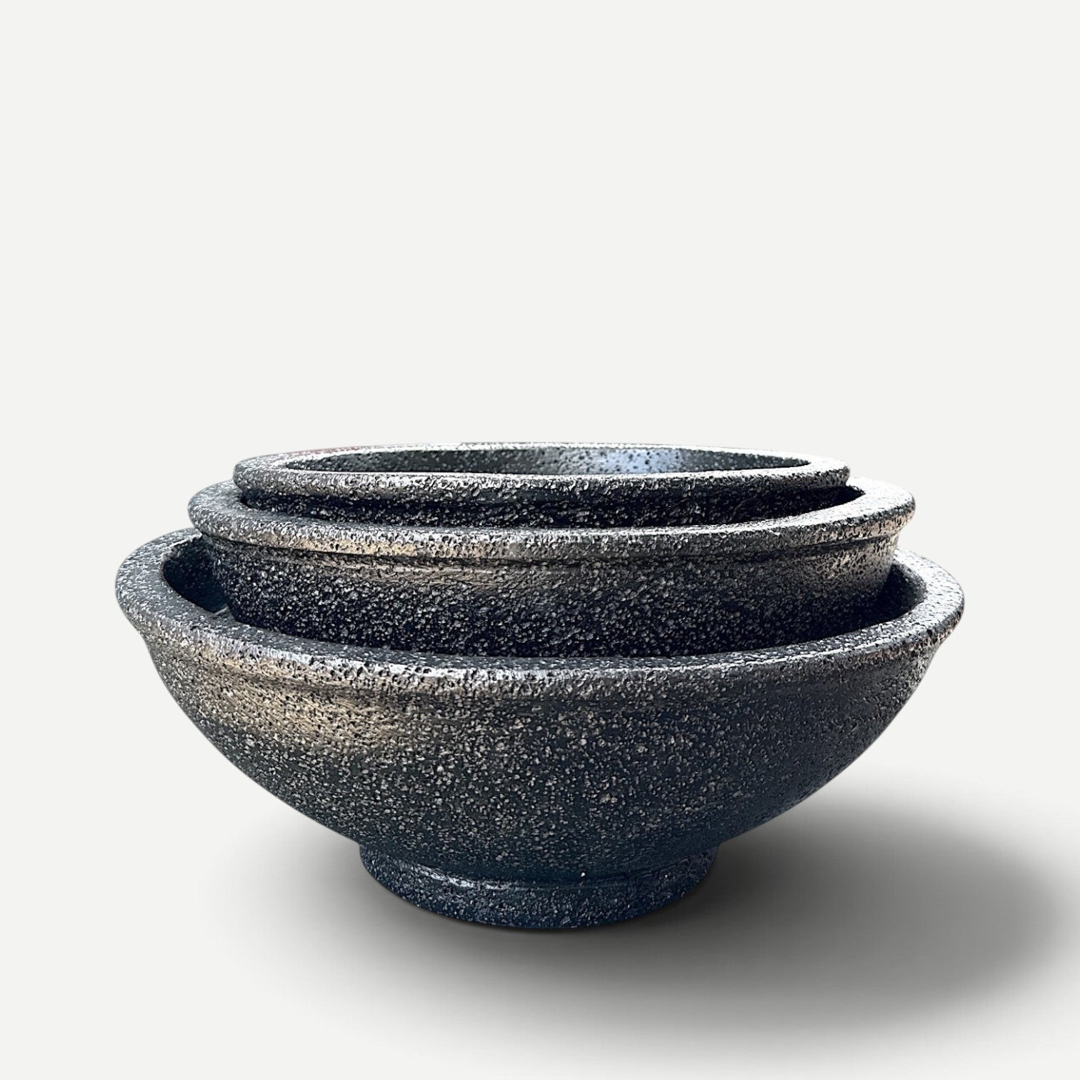 Hawaiian Discovery Furniture Maru round bonsai planters in a nested set, made from lightweight concrete and foam.