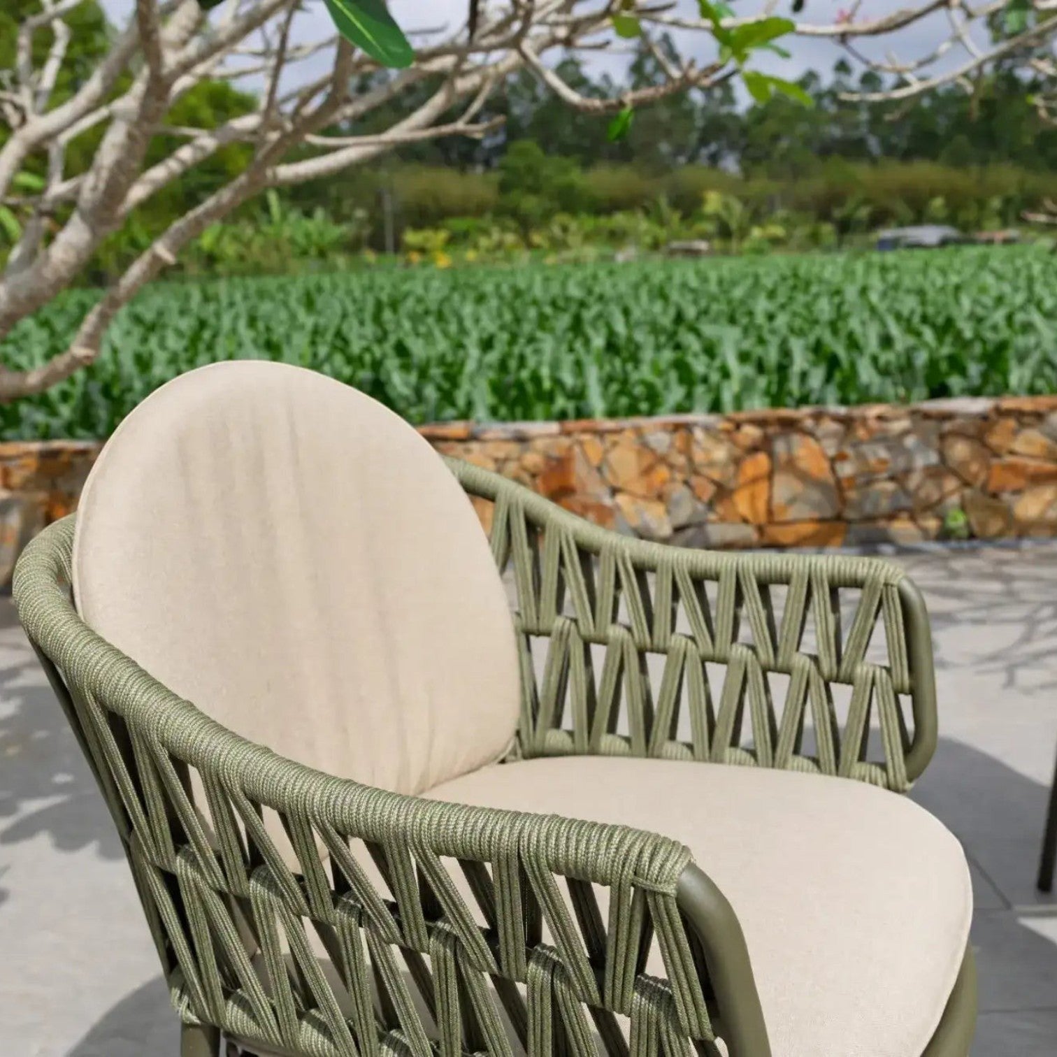 Hawaiian Discovery Furniture Moana outdoor bar chair with olive green woven rope frame and beige seat cushions.