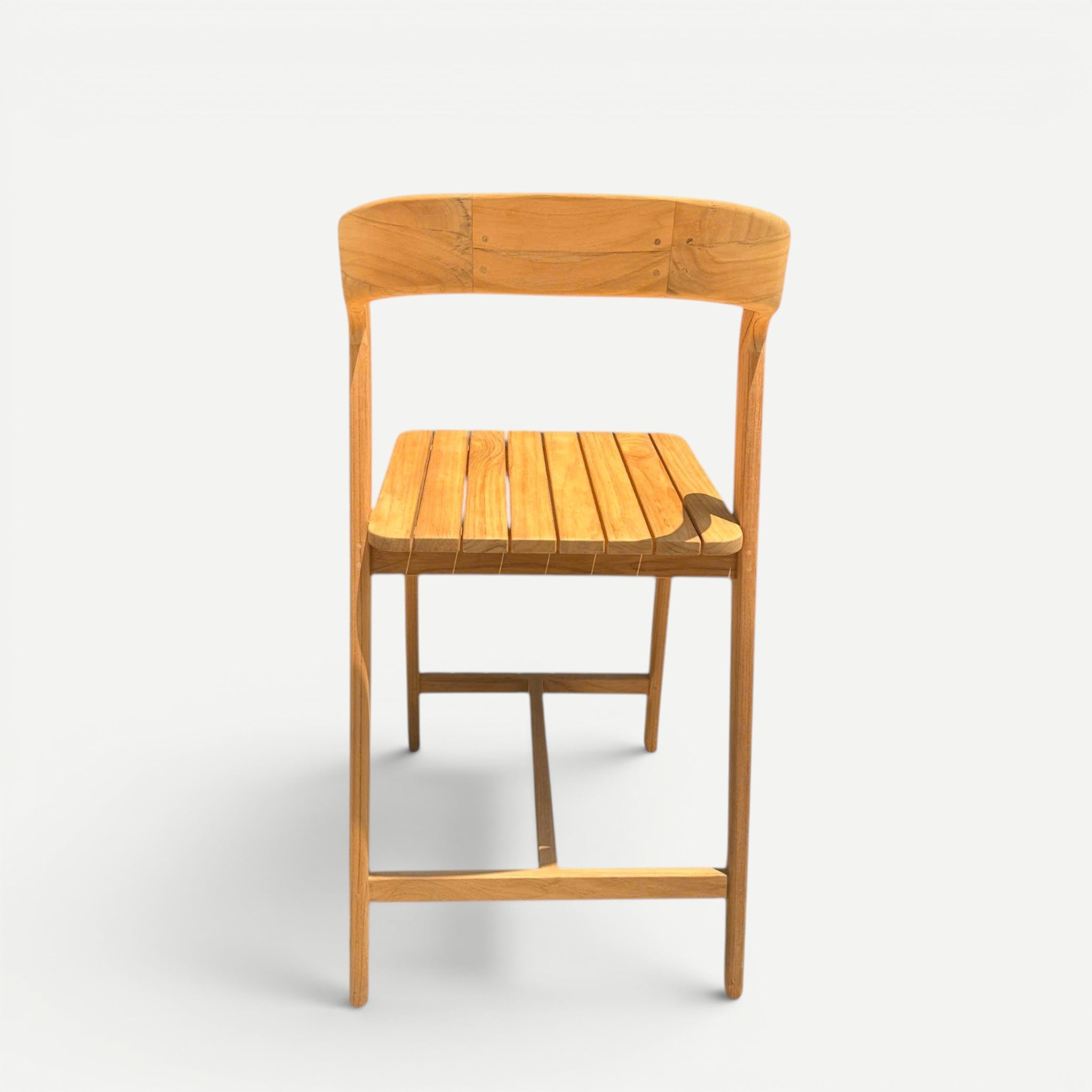Hawaiian Discovery Furniture Noho teak counter stool with a slatted seat and curved backrest in natural golden wood.