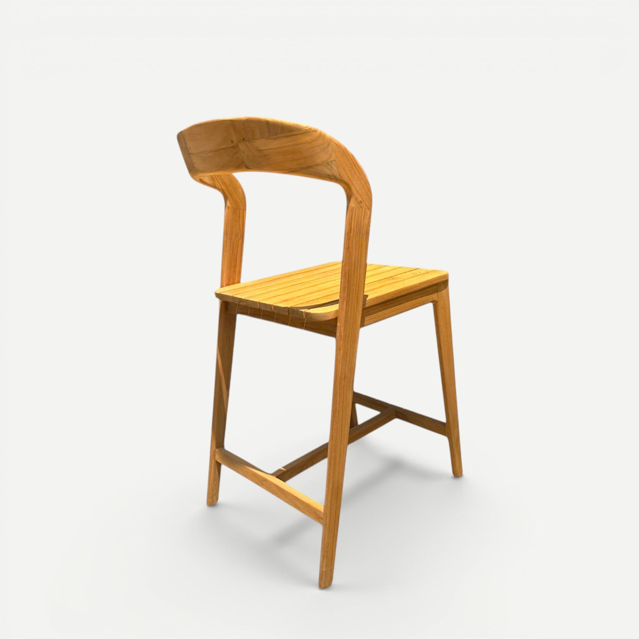 Hawaiian Discovery Furniture Noho teak counter stool with a slatted seat and curved backrest in a natural wood finish.