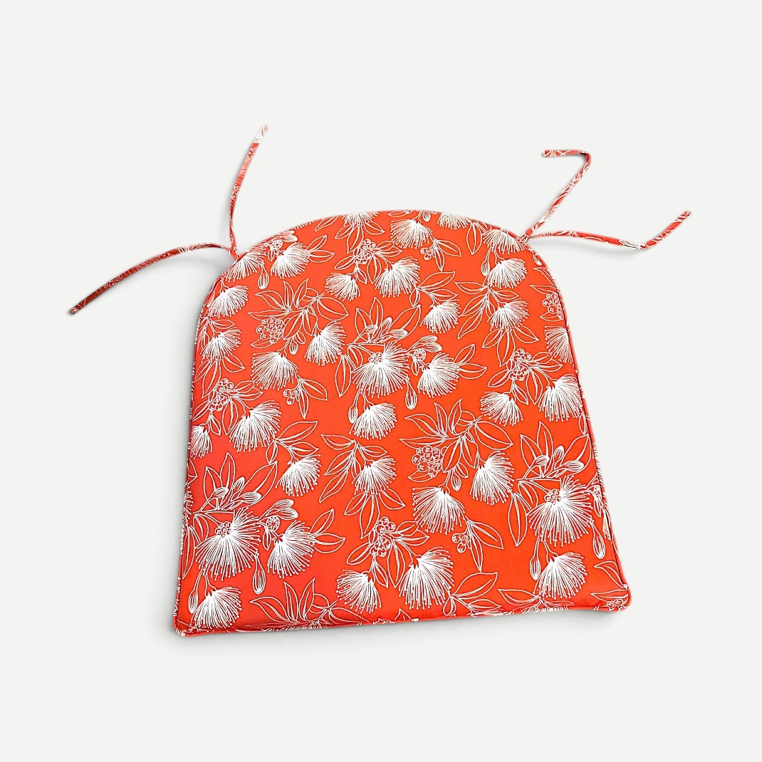 Hawaiian Discovery Furniture polyester chair pad in orange with white floral pattern for Haleiwa dining chairs