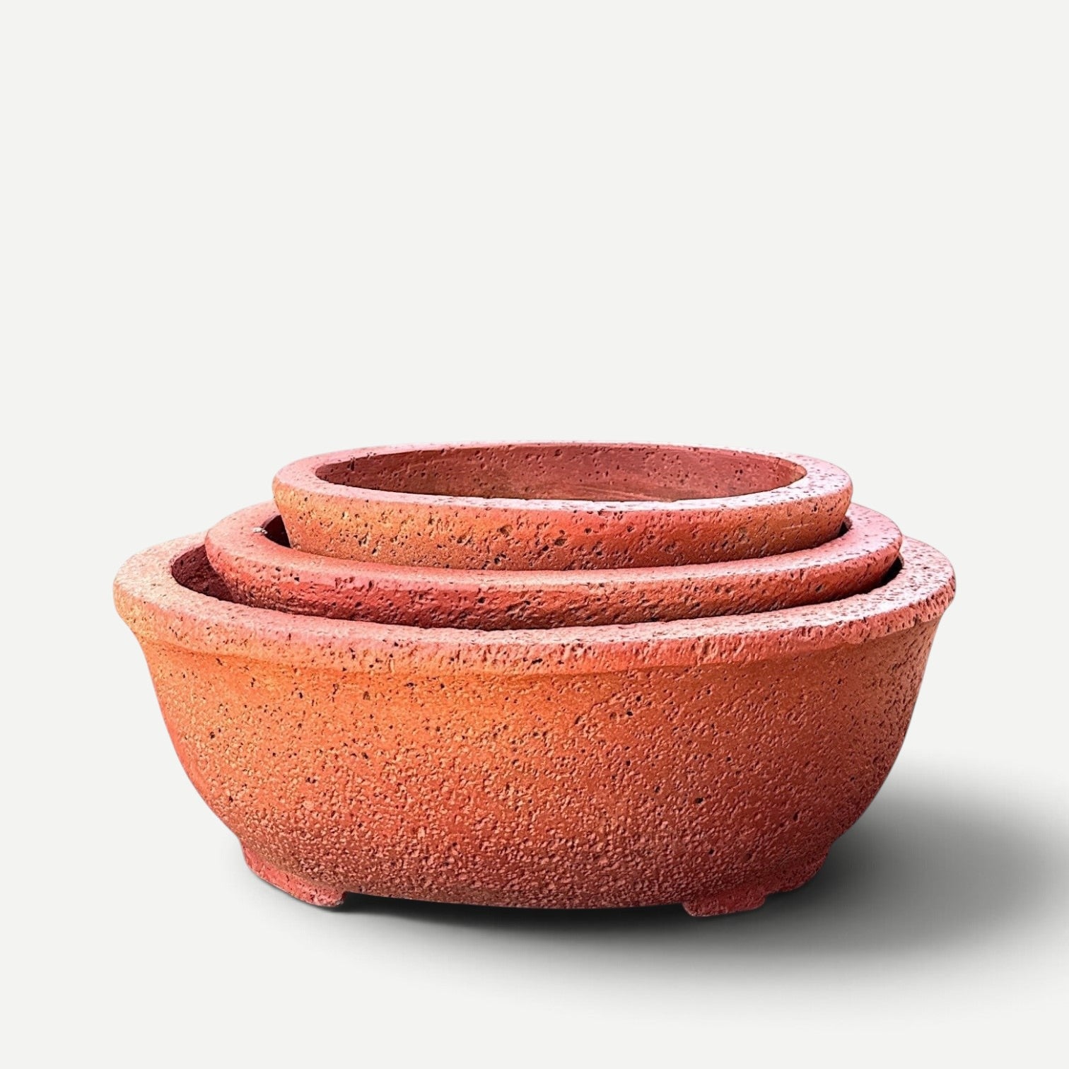 Hawaiian Discovery Furniture Kumo oval bonsai planters in a nested set, made from lightweight concrete and foam.