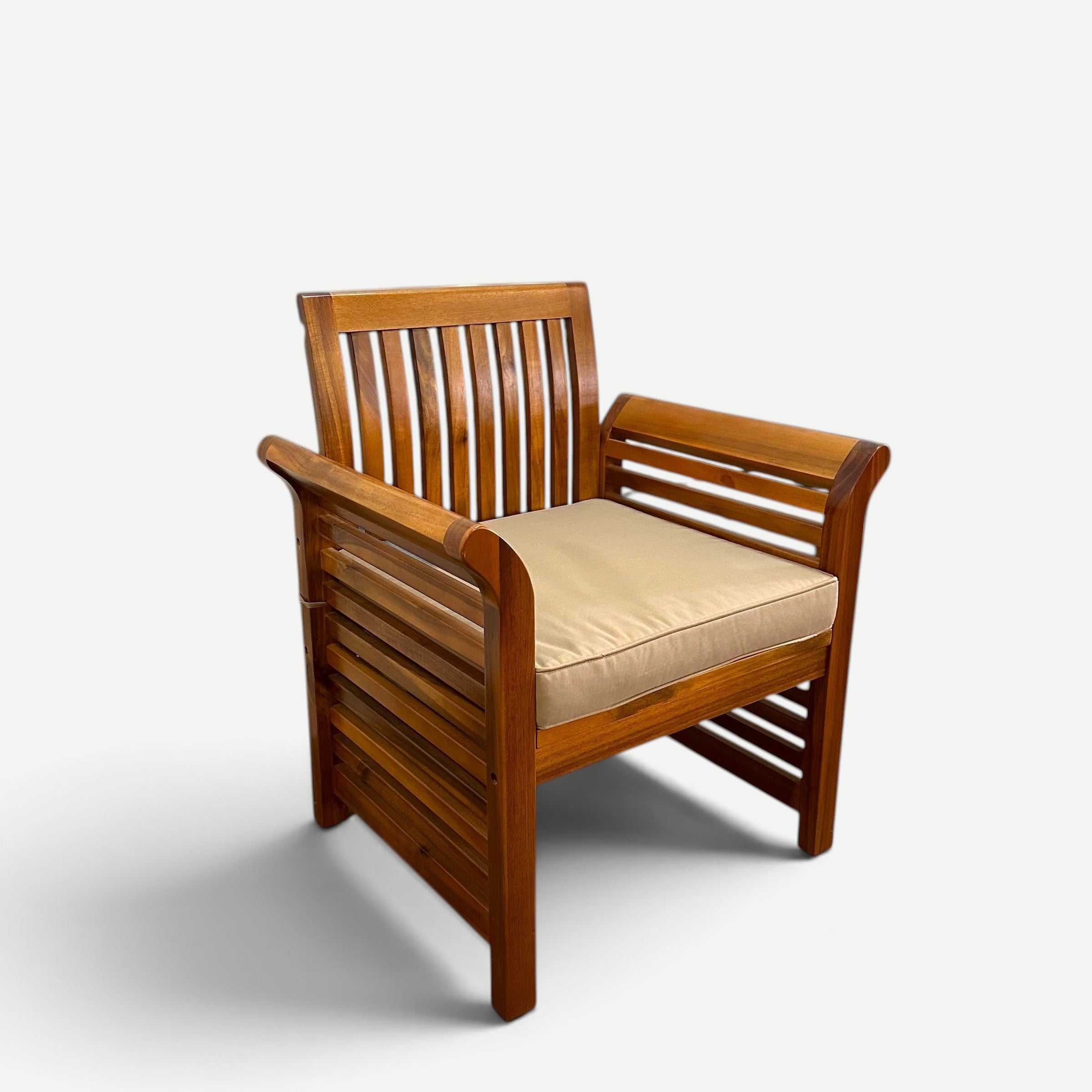 Hawaiian Discovery Furniture Riviera armchair featuring a thick 3-inch beige cushion on a slatted teak wood frame.