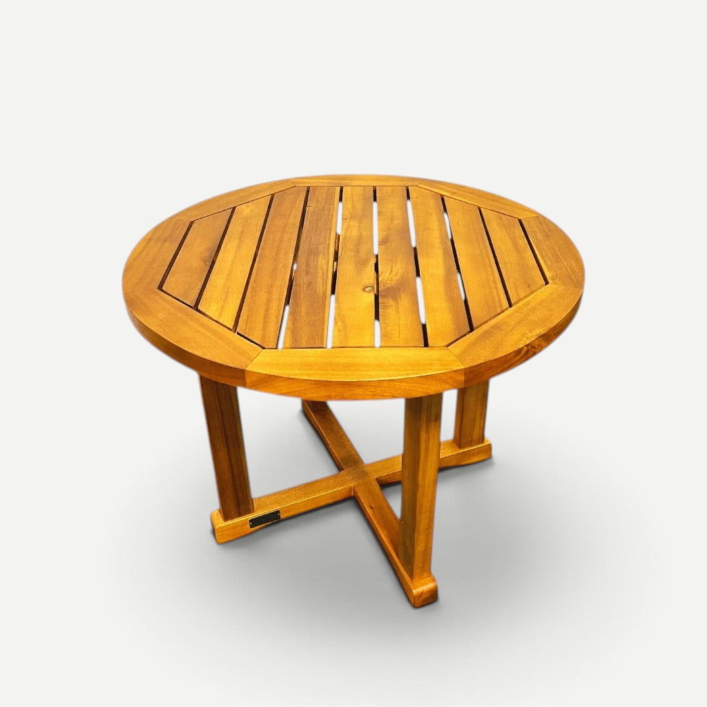 Hawaiian Discovery Furniture round side table made from natural plantation-grown acacia wood with a slatted top.