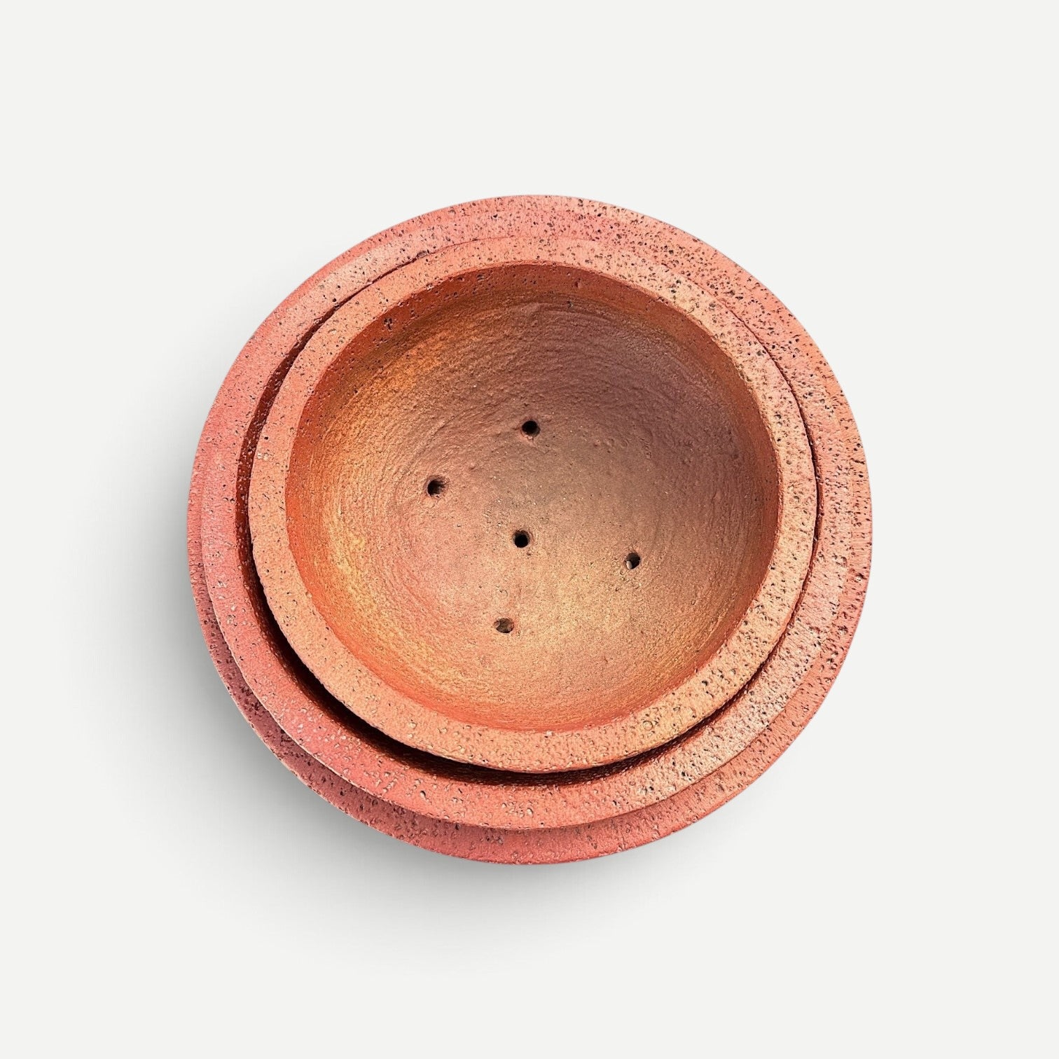 Hawaiian Discovery Furniture Maru round bonsai planter in terracotta with a textured concrete and foam finish
