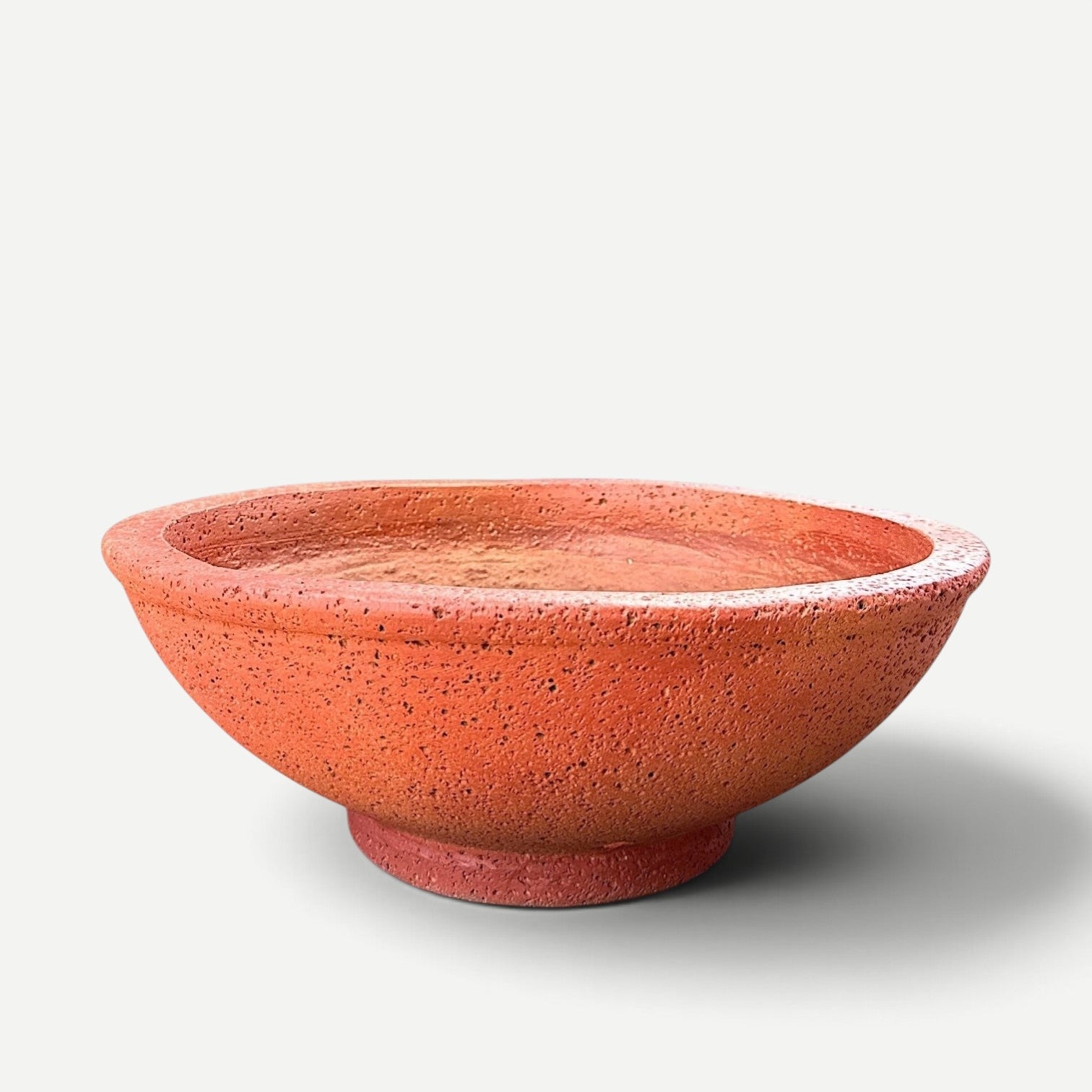 Hawaiian Discovery Furniture Maru round bonsai planter in terracotta-colored lightweight concrete and foam composite.