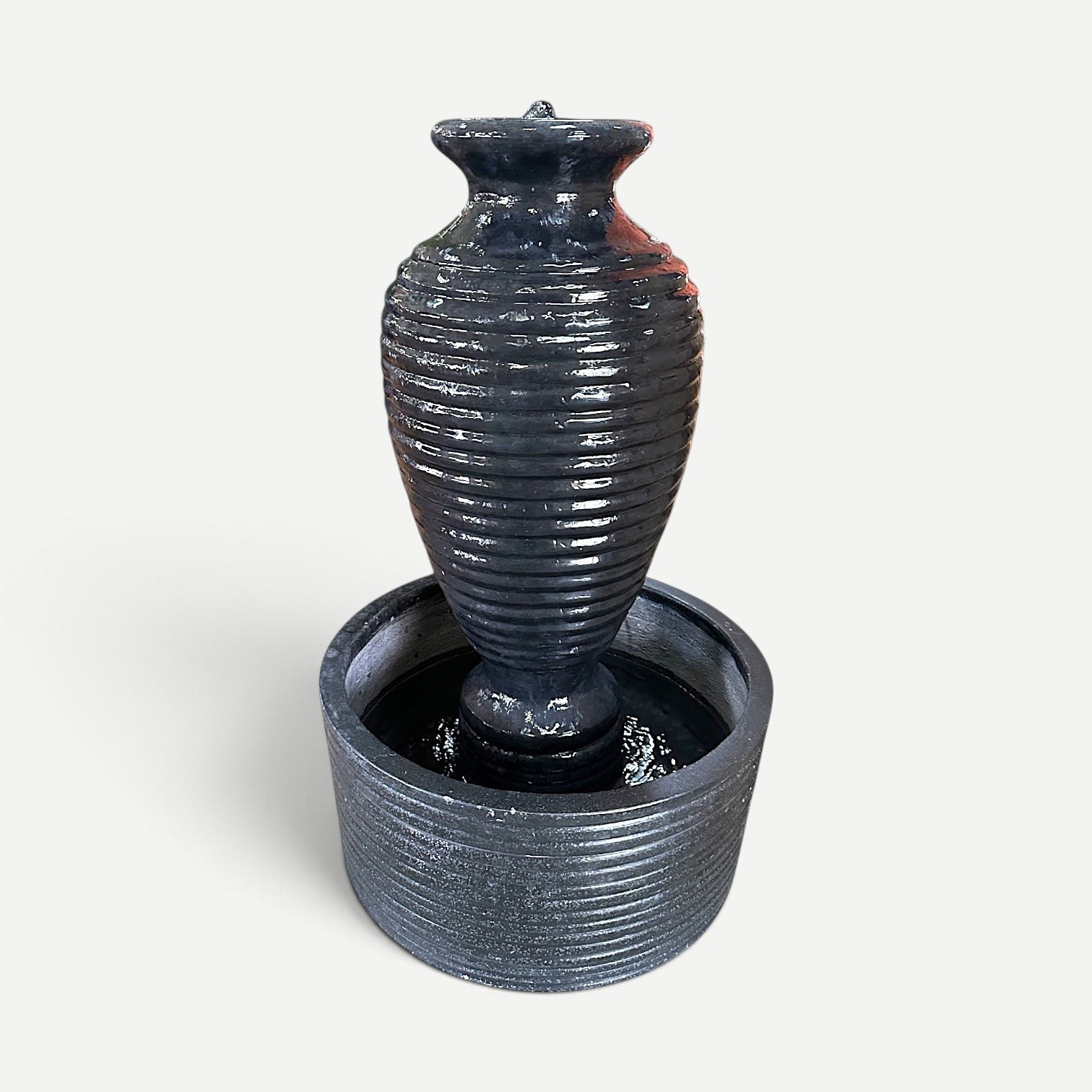 Hawaiian Discovery Furniture tall cement vase fountain with a ribbed texture in a dark grey finish