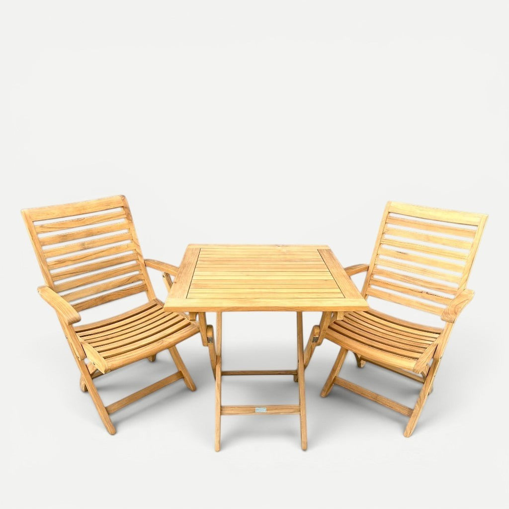 Hawaiian Discovery Furniture Kakahiaka teak bistro set with two folding armchairs and a square folding table.