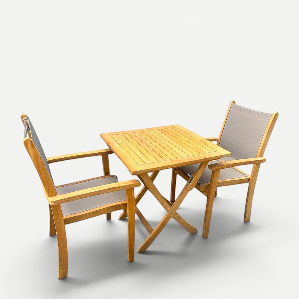 Hawaiian Discovery Furniture Kakahiaka set with two taupe sling Pearl arm chairs and a square folding teak table.