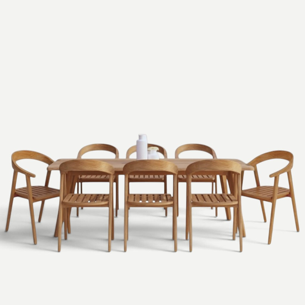 Hawaiian Discovery Furniture La Costa teak dining table set with six matching wooden chairs on a white background
