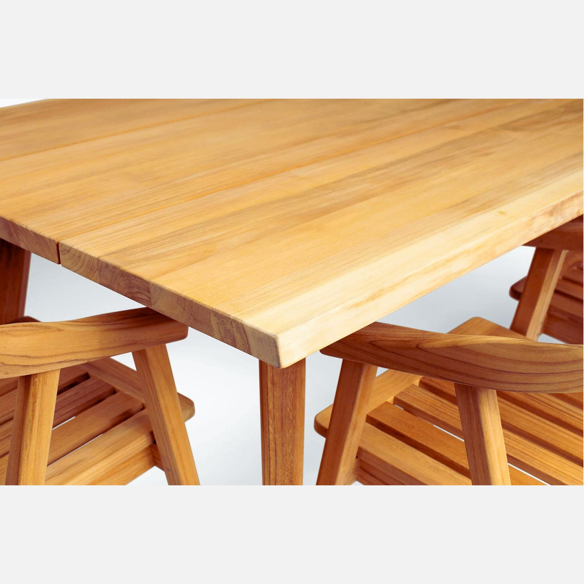 Hawaiian Discovery Furniture La Costa teak outdoor dining table with a natural golden wood finish and plank surface