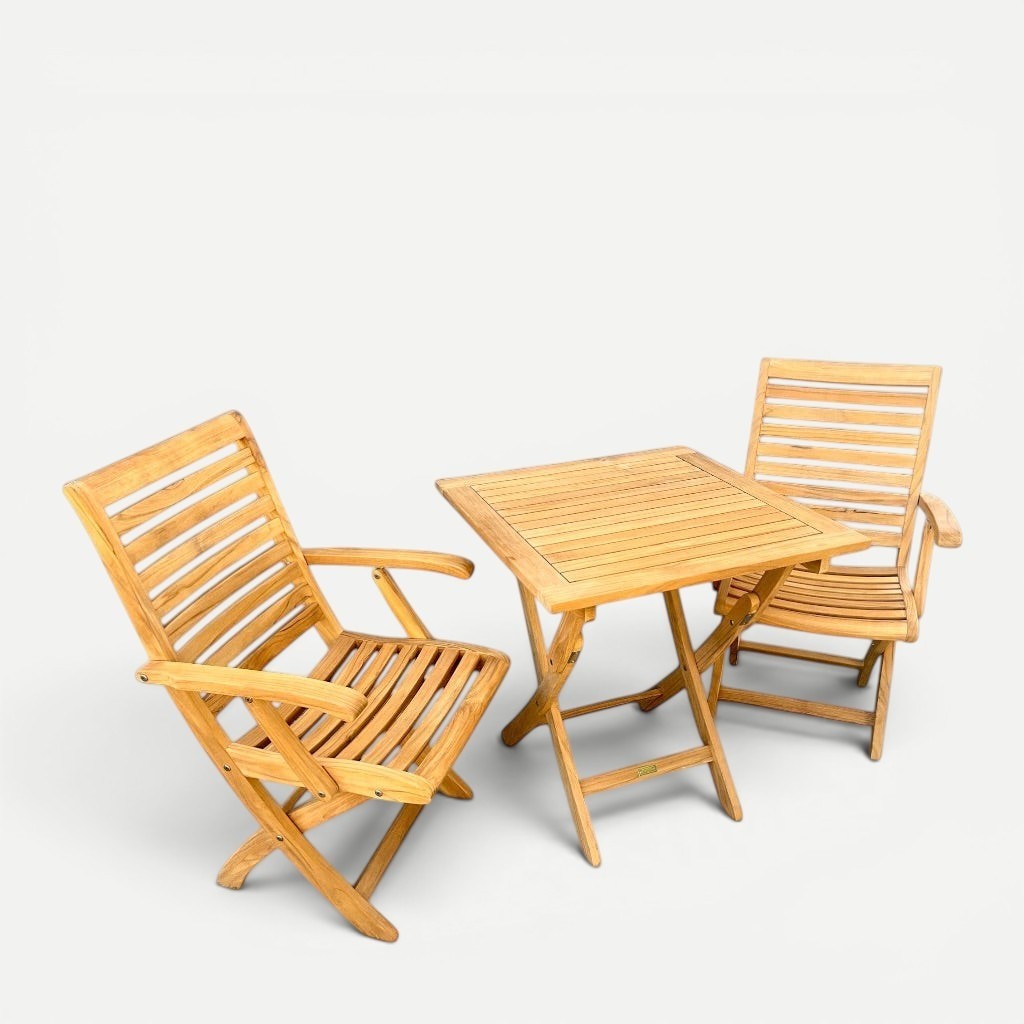 Hawaiian Discovery Furniture Kakahiaka set featuring two teak folding armchairs and a square folding patio table.
