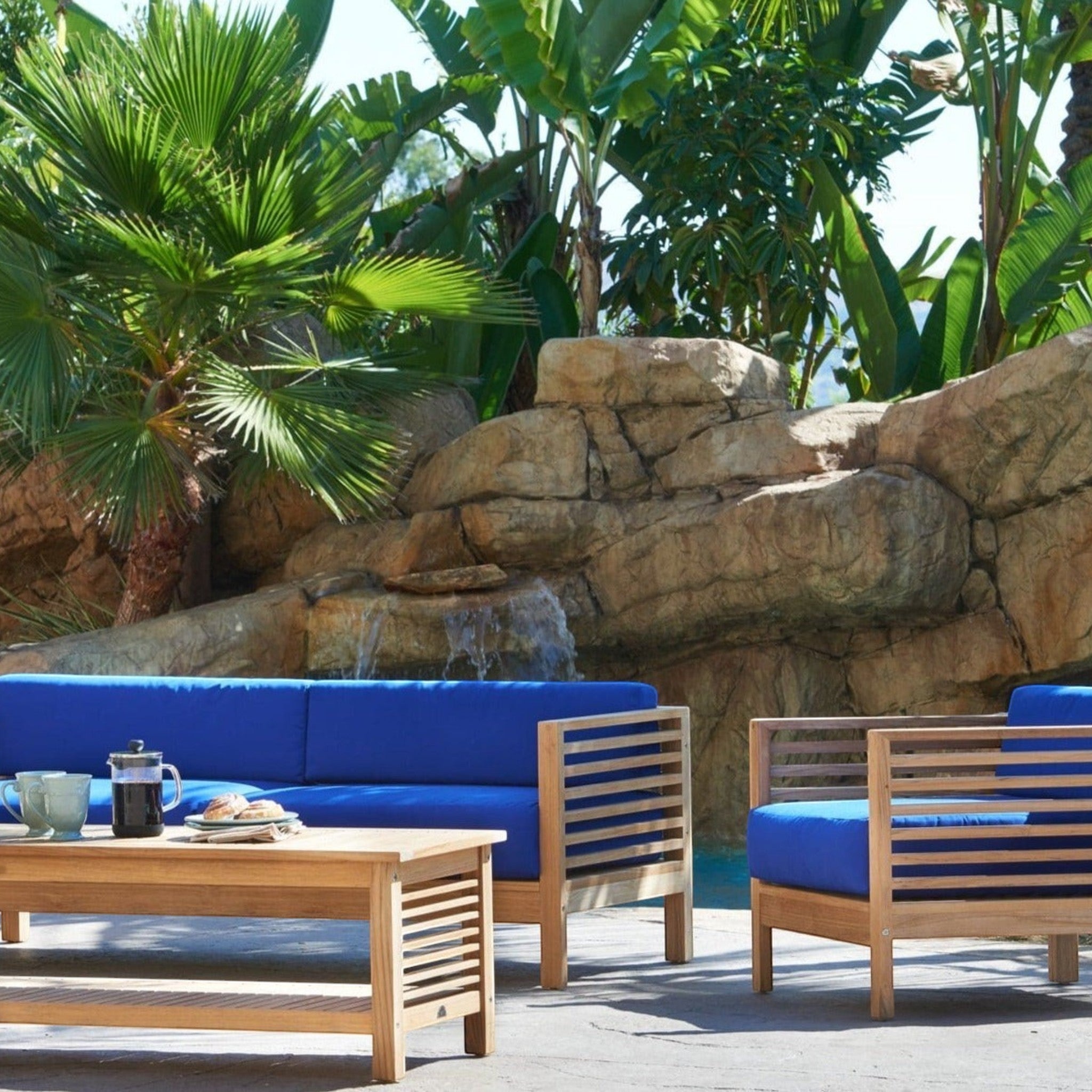 Hawaiian Discovery Furniture Summer loveseat and club chair set with blue cushions and solid teak wood frames.