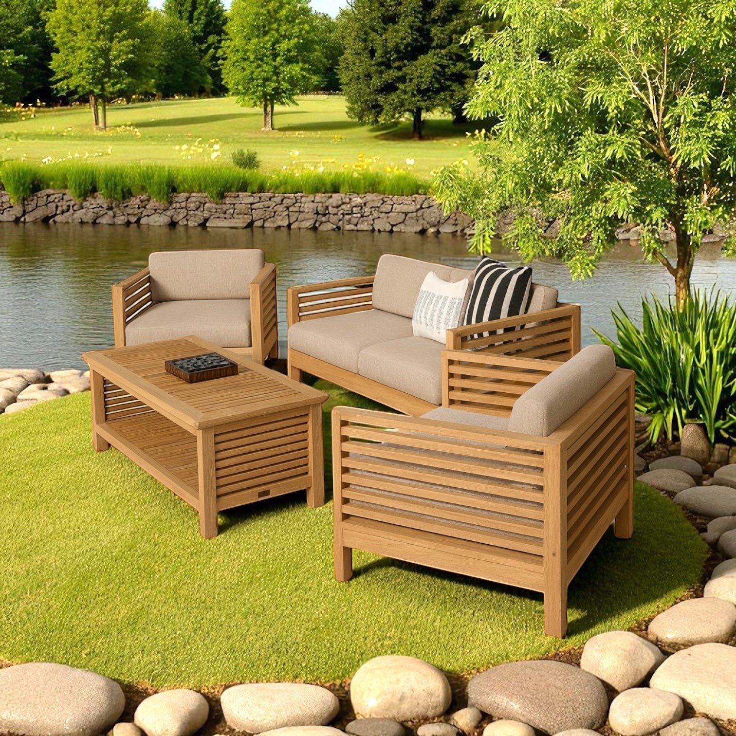 Hawaiian Discovery Furniture Summer Loveseat set with teak wood frames and taupe cushions on a grassy patio by a pond.