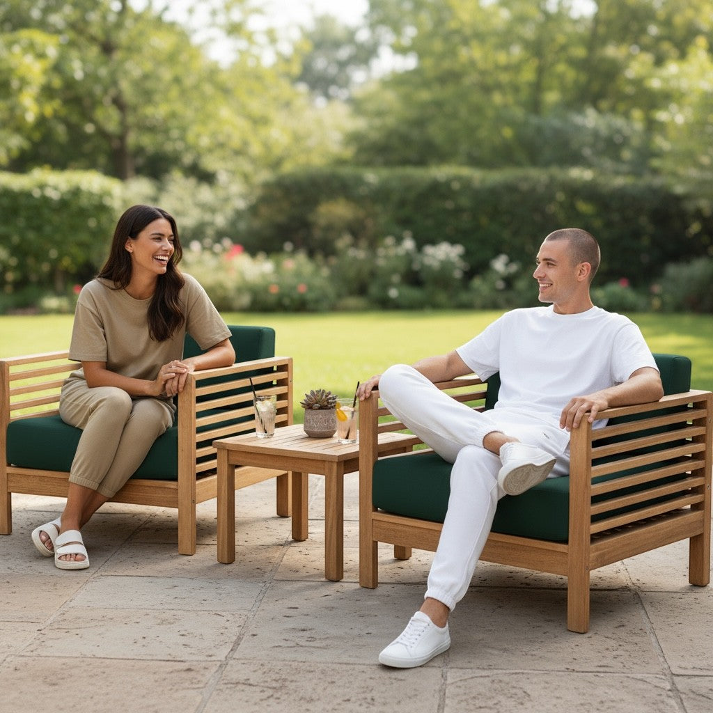 Hawaiian Discovery Furniture Summer Small Area Set with two teak club chairs, green cushions, and a side table on a patio.