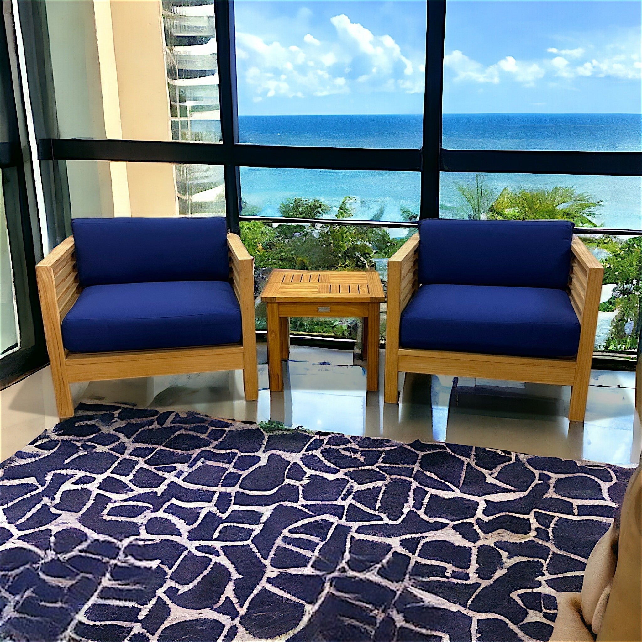 Hawaiian Discovery Furniture Summer Small Area Set with two teak club chairs and side table on a patterned rug.