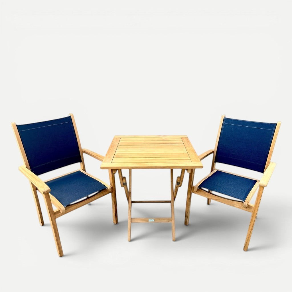 Hawaiian Discovery Furniture Kakahiaka set featuring two teak Pearl arm chairs with blue sling and square folding table
