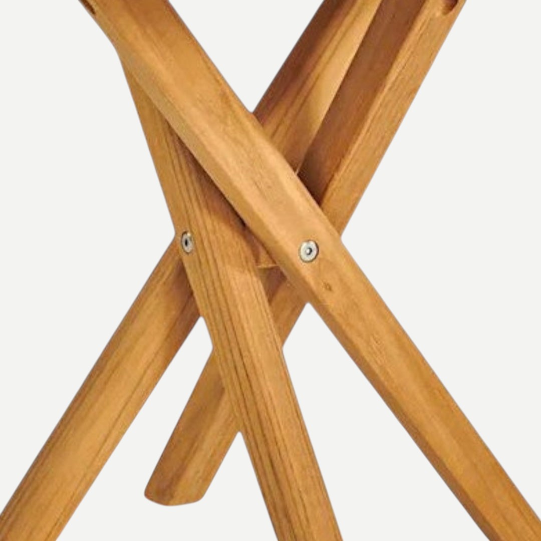 Hawaiian Discovery Furniture Tulum teak side table featuring a sturdy crossed-leg design with stainless steel hardware.