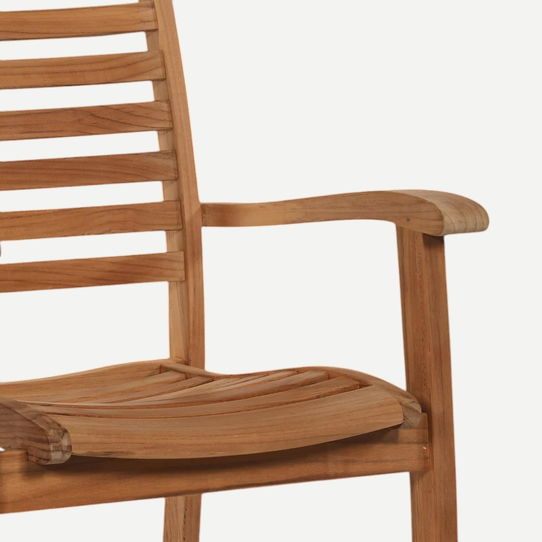 Hawaiian Discovery Furniture Birmingham stacking armchair made of premium golden teak wood with curved slat design.