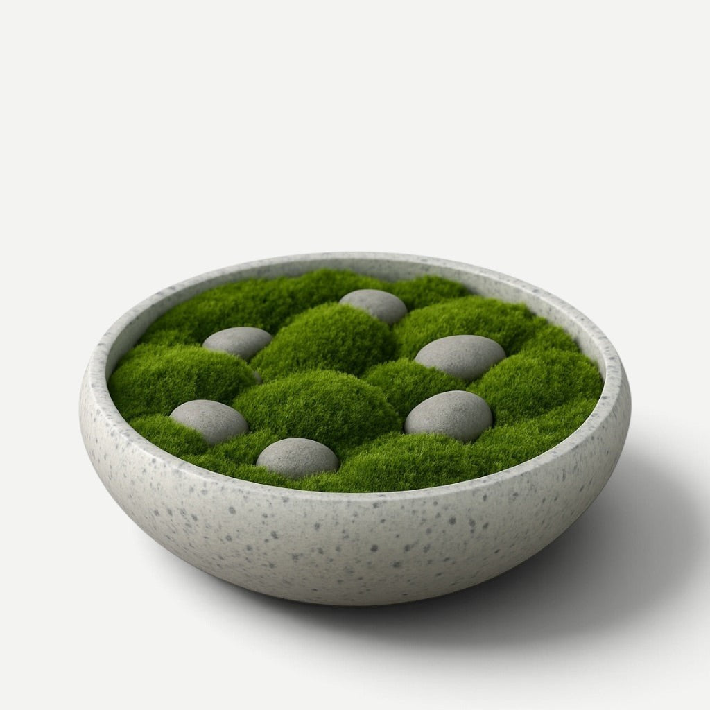 Hawaiian Discovery Furniture Calabash terrazzo planter bowl filled with lush green moss and smooth grey river stones