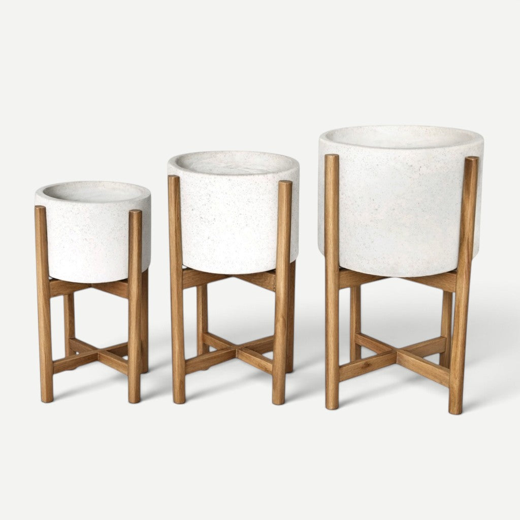 Hawaiian Discovery Furniture terrazzo planters in three sizes with white cement pots and acacia wood stands.