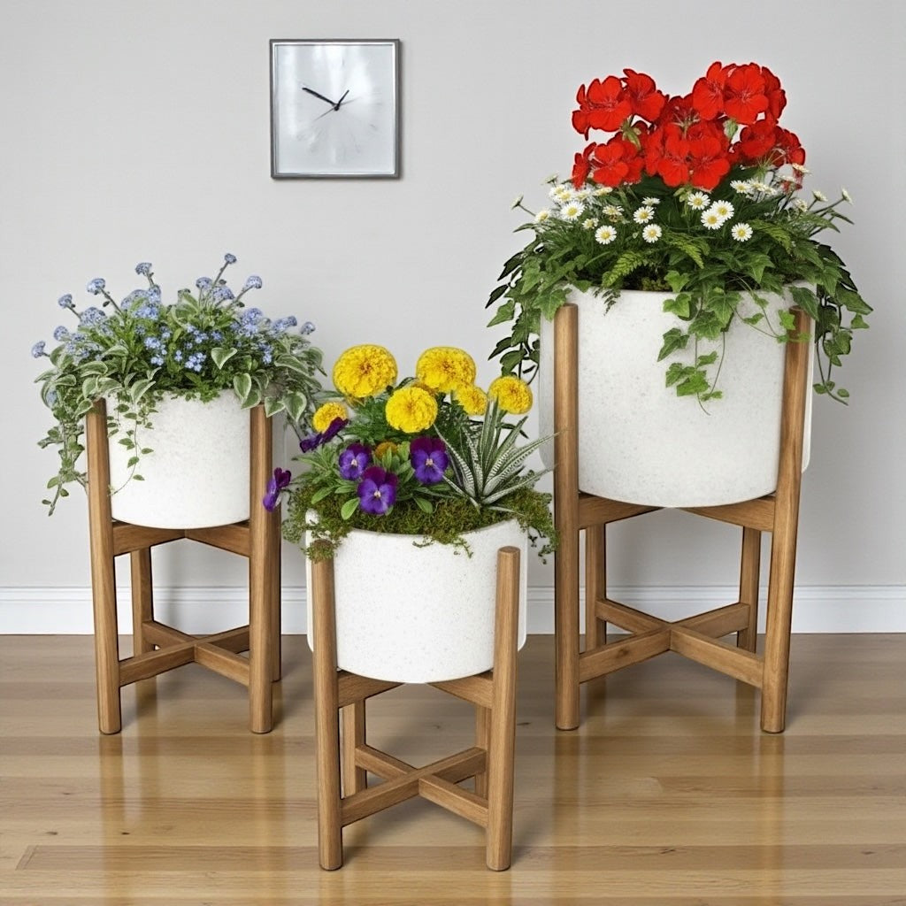 Hawaiian Discovery Furniture terrazzo planters in white with acacia wood stands, featuring vibrant floral arrangements