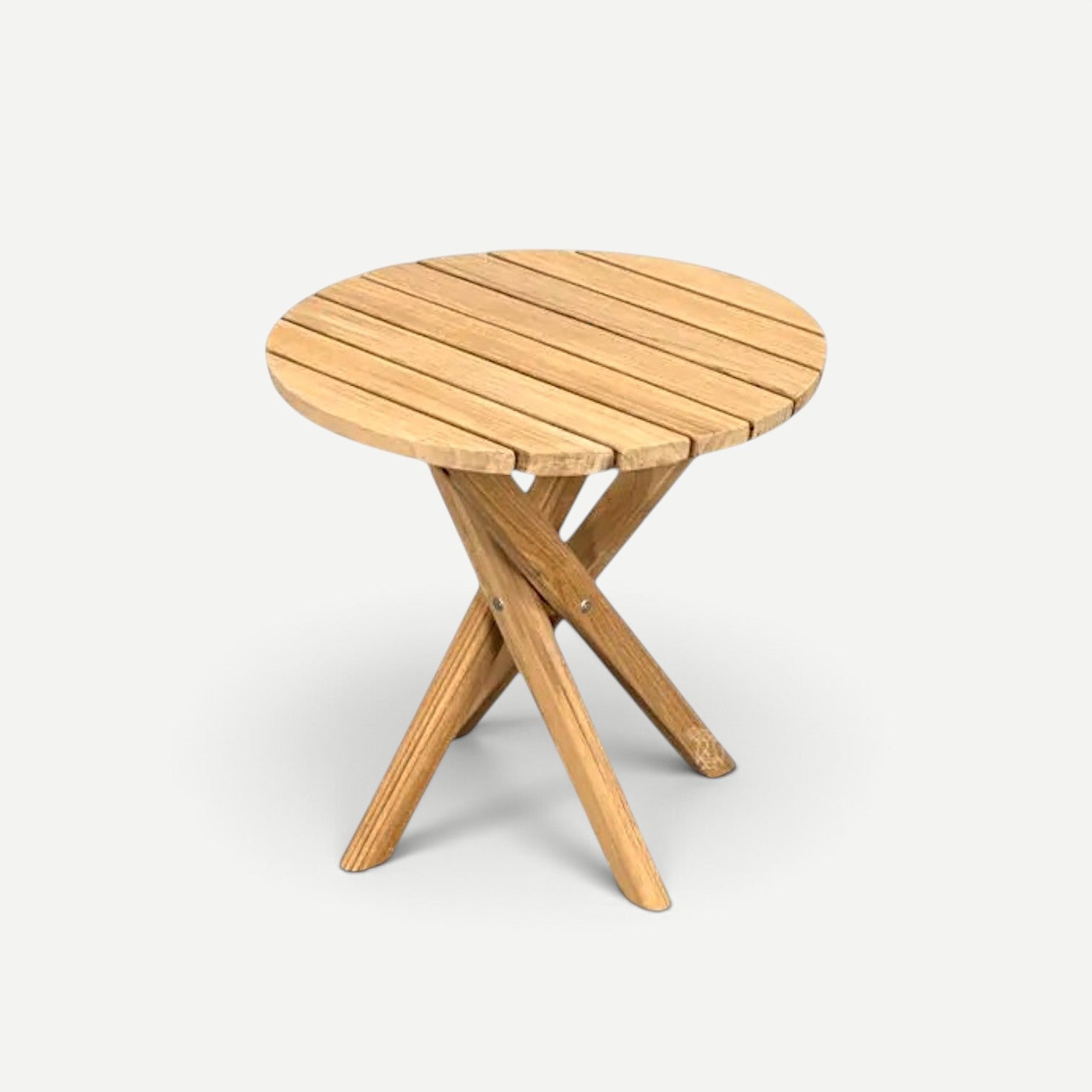 Hawaiian Discovery Furniture Tulum round teak side table with a sturdy crossed-leg design for outdoor living spaces.