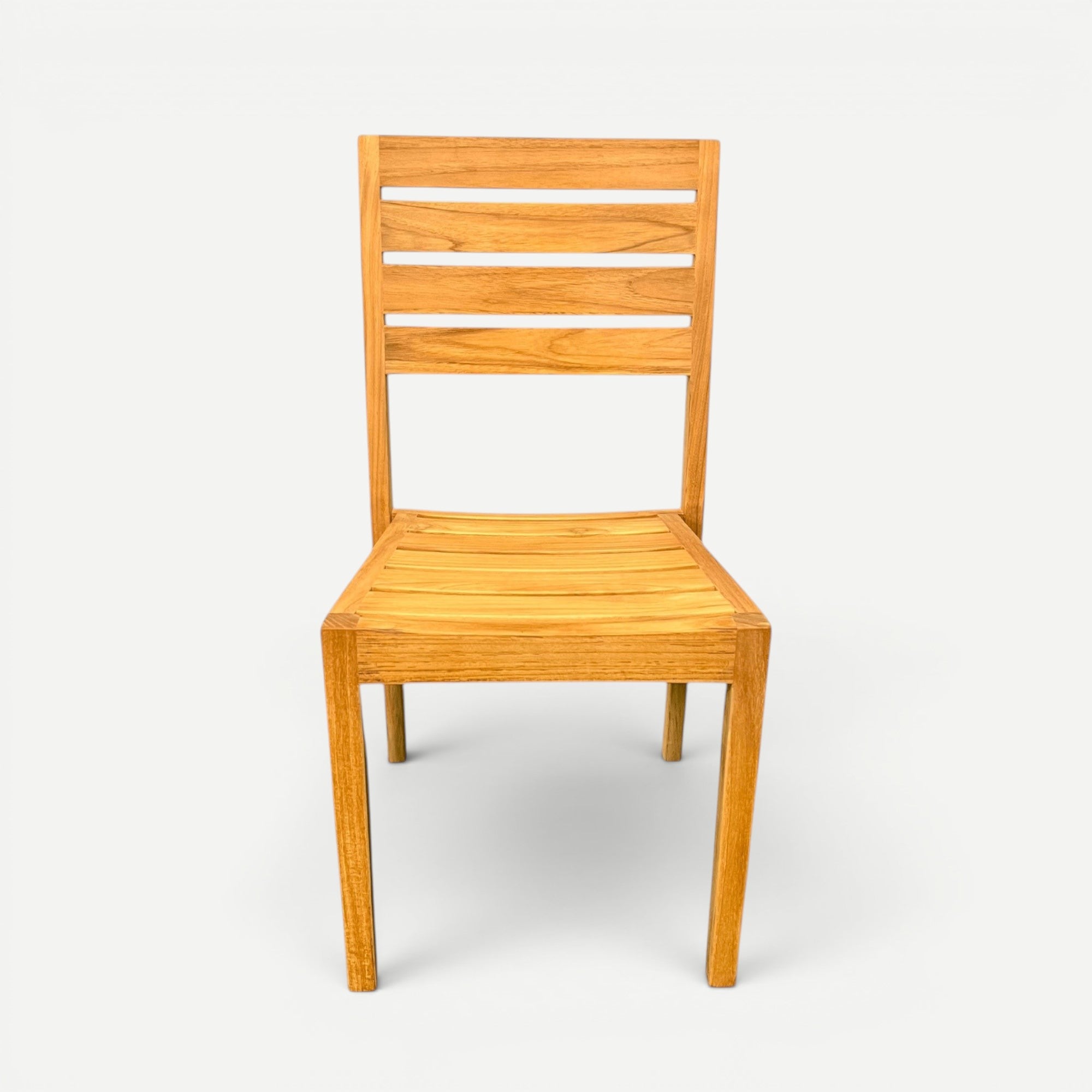 Hawaiian Discovery Furniture Venice teak outdoor side chair with a slatted back and natural golden wood finish.