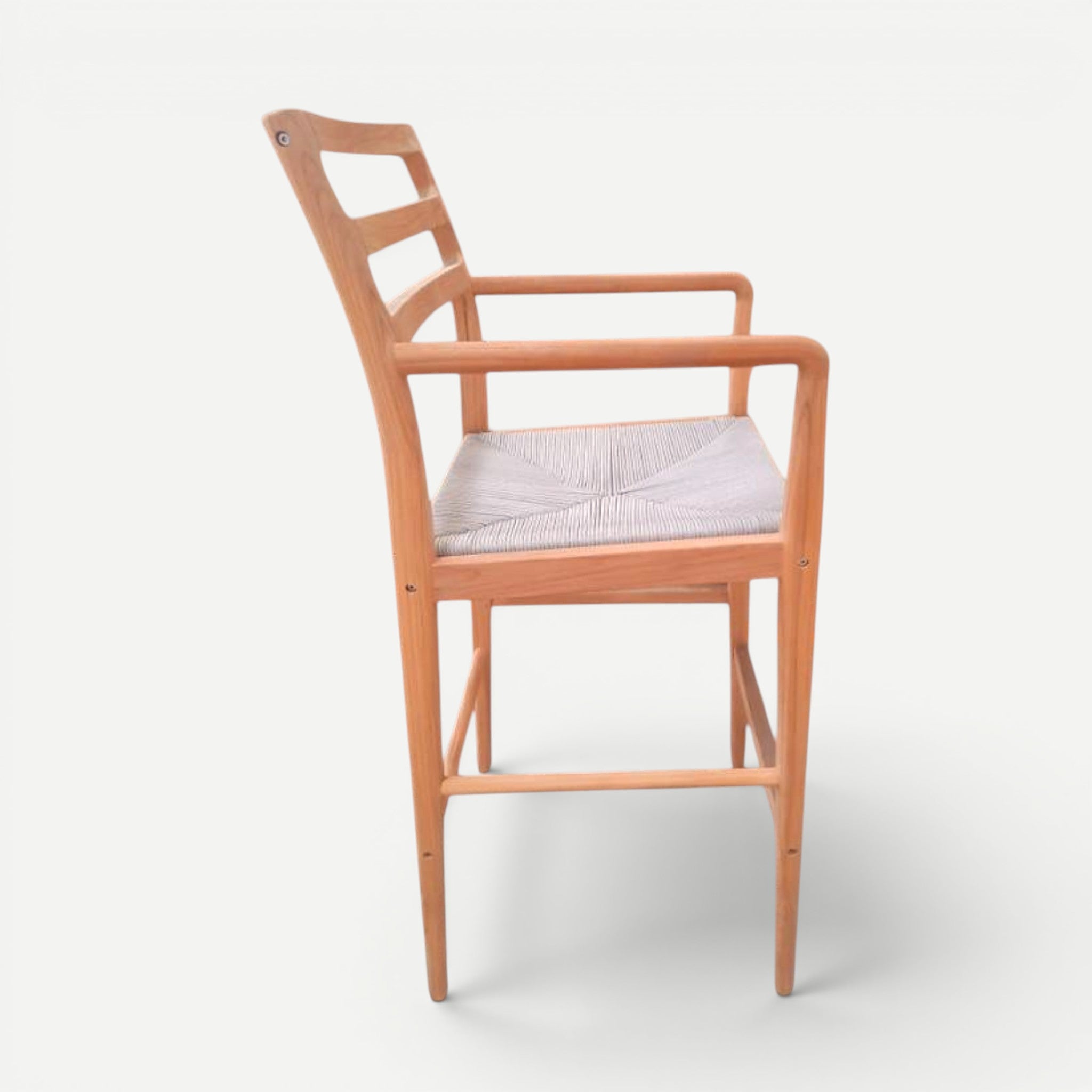 Hawaiian Discovery Furniture Wailea teak barstool with a handwoven seat and sculpted armrests in a side profile view.
